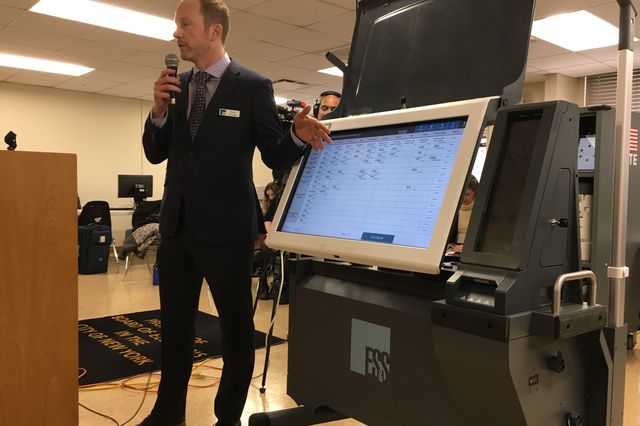 Kevin Kerrigan from Election Systems & Software giving a demonstration of the Express Vote XL to the New York City Board of Elections Commissioners in April, 2019.